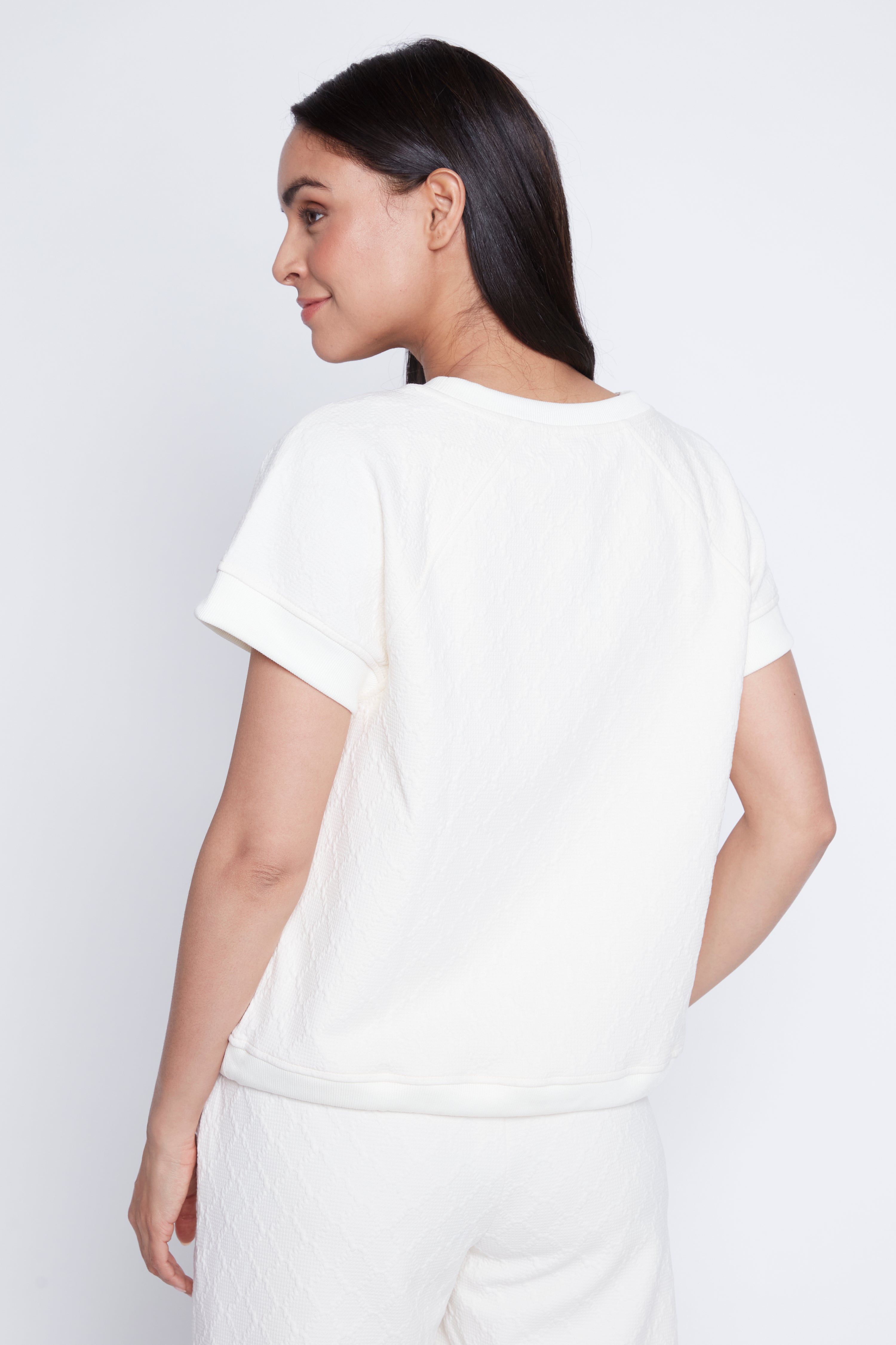 Le haut à ourlet à cordon en maille losange