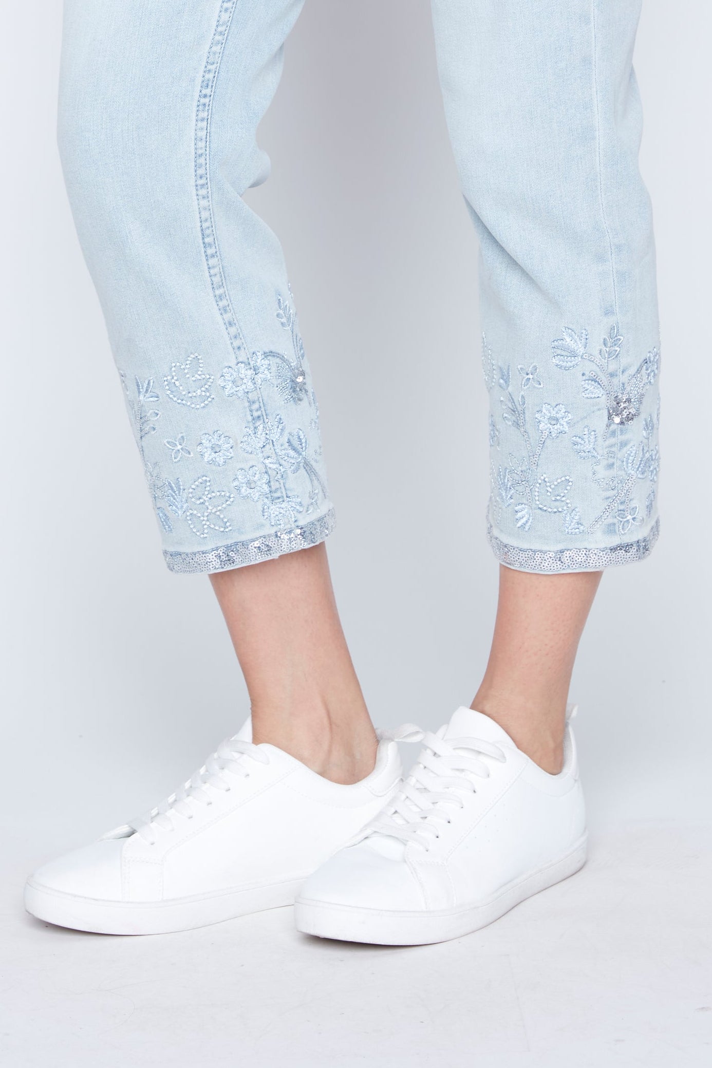 Slim leg embroidered hem jean