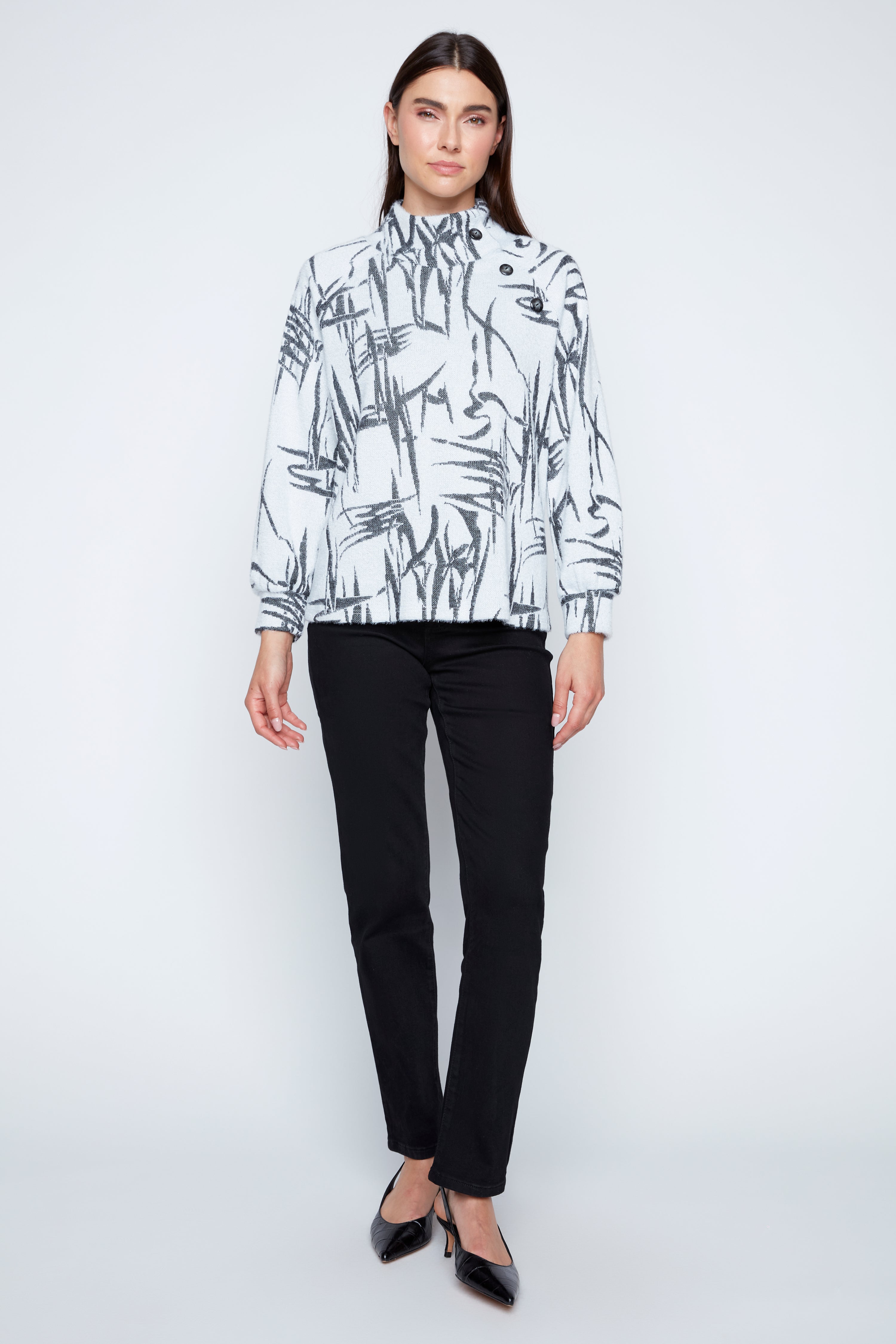 Le haut à cils avec détail boutonné