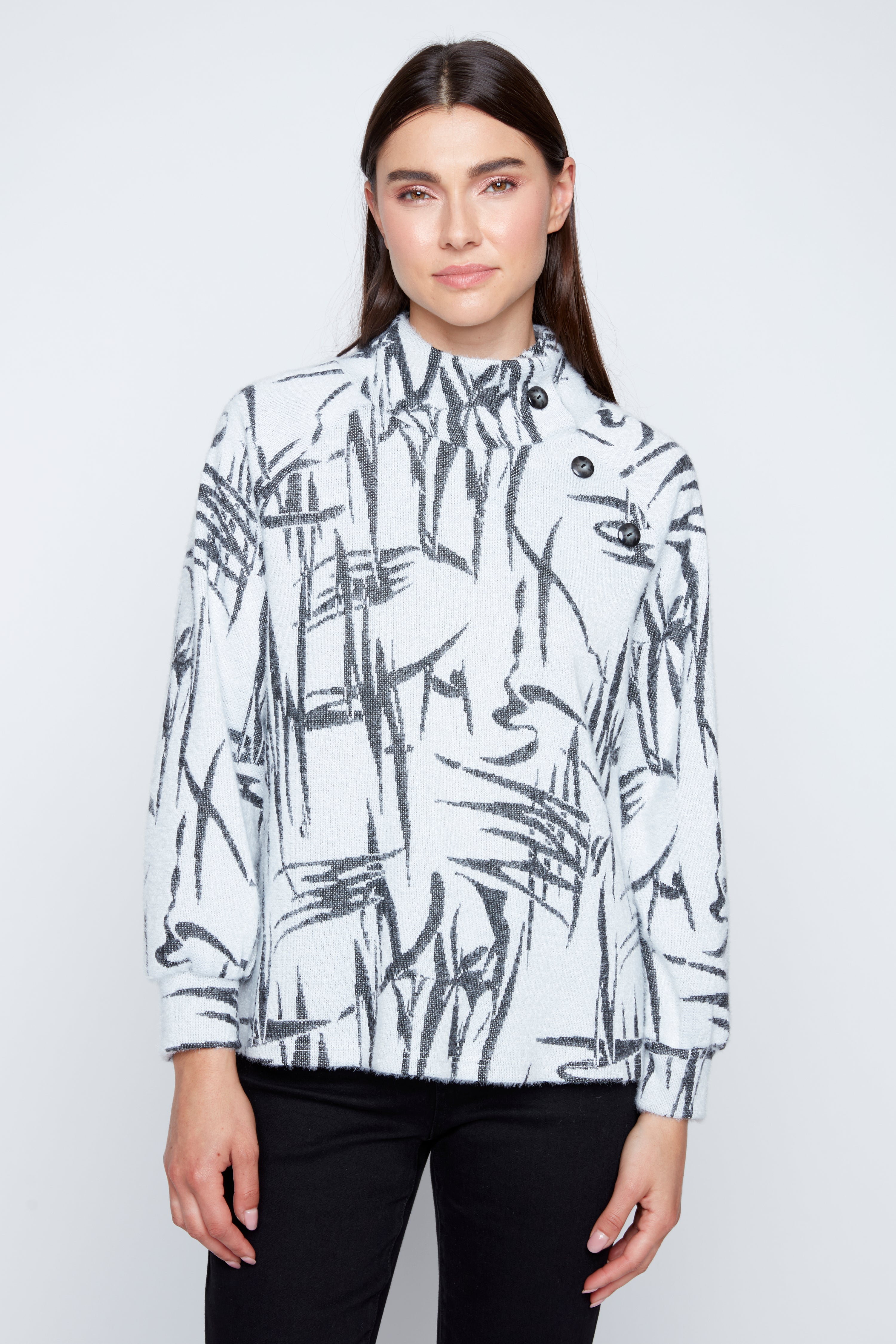 Le haut à cils avec détail boutonné