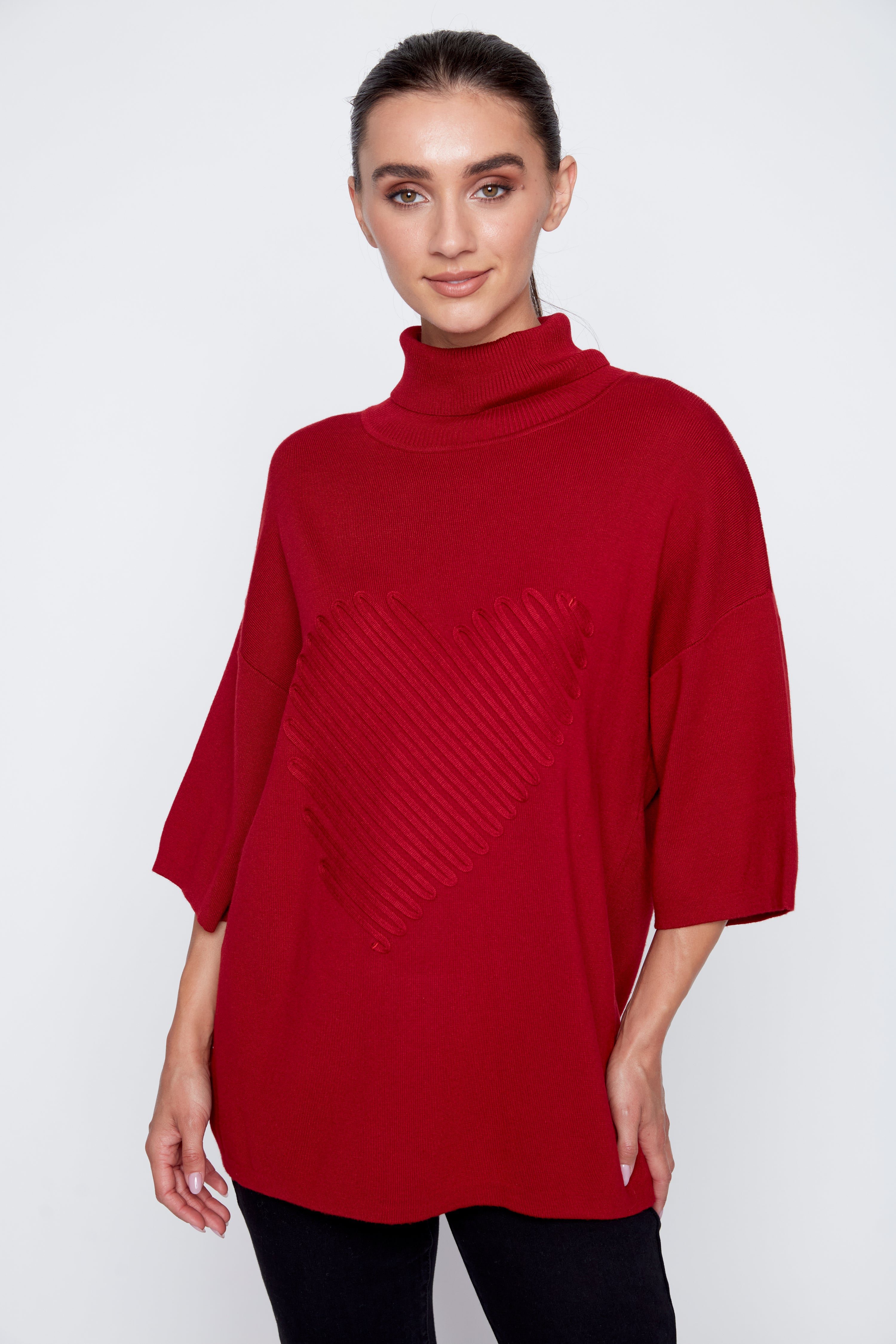 Le pull avec détails de cœur