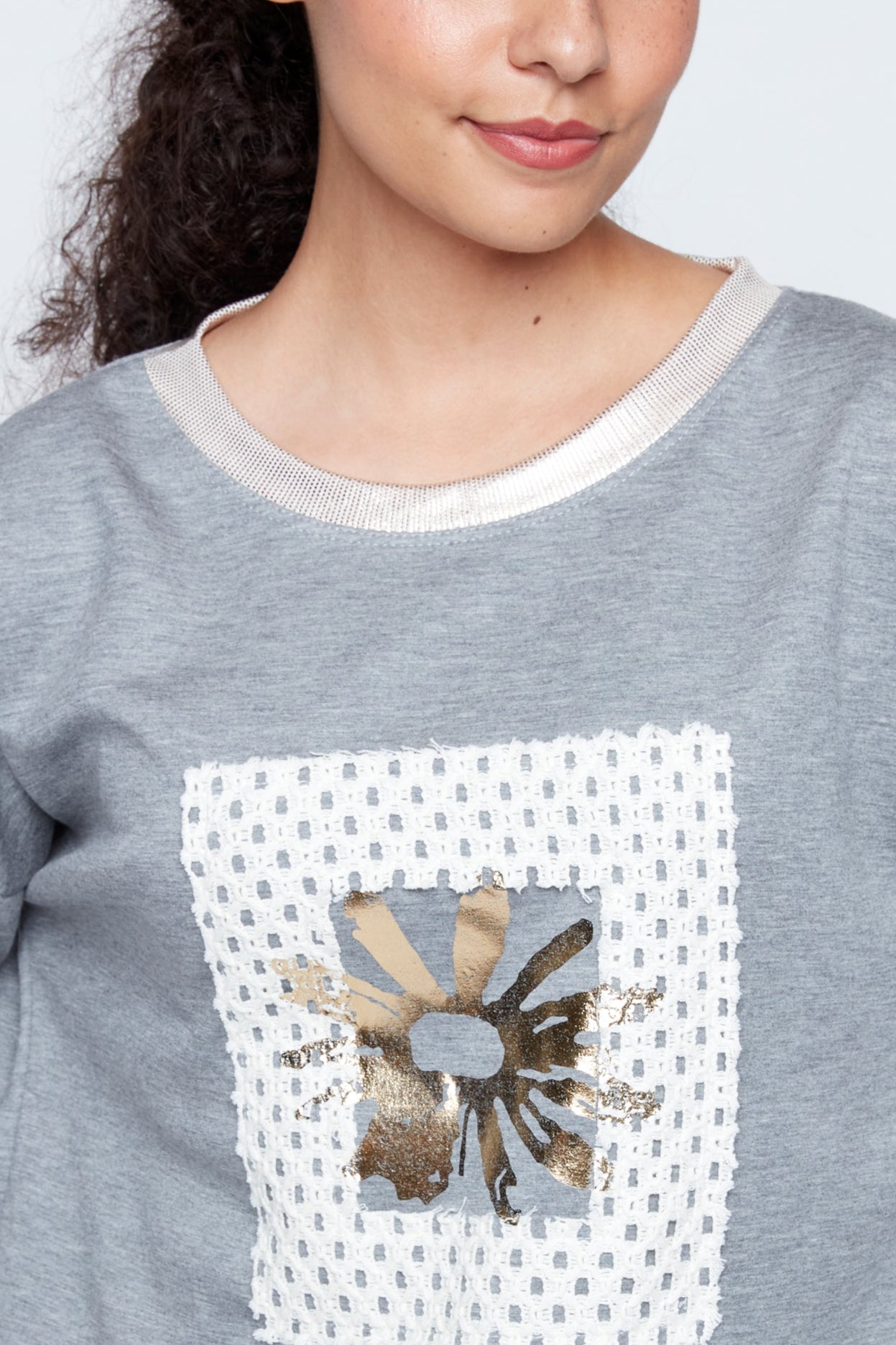 Foil sunflower with crochet applique sweater