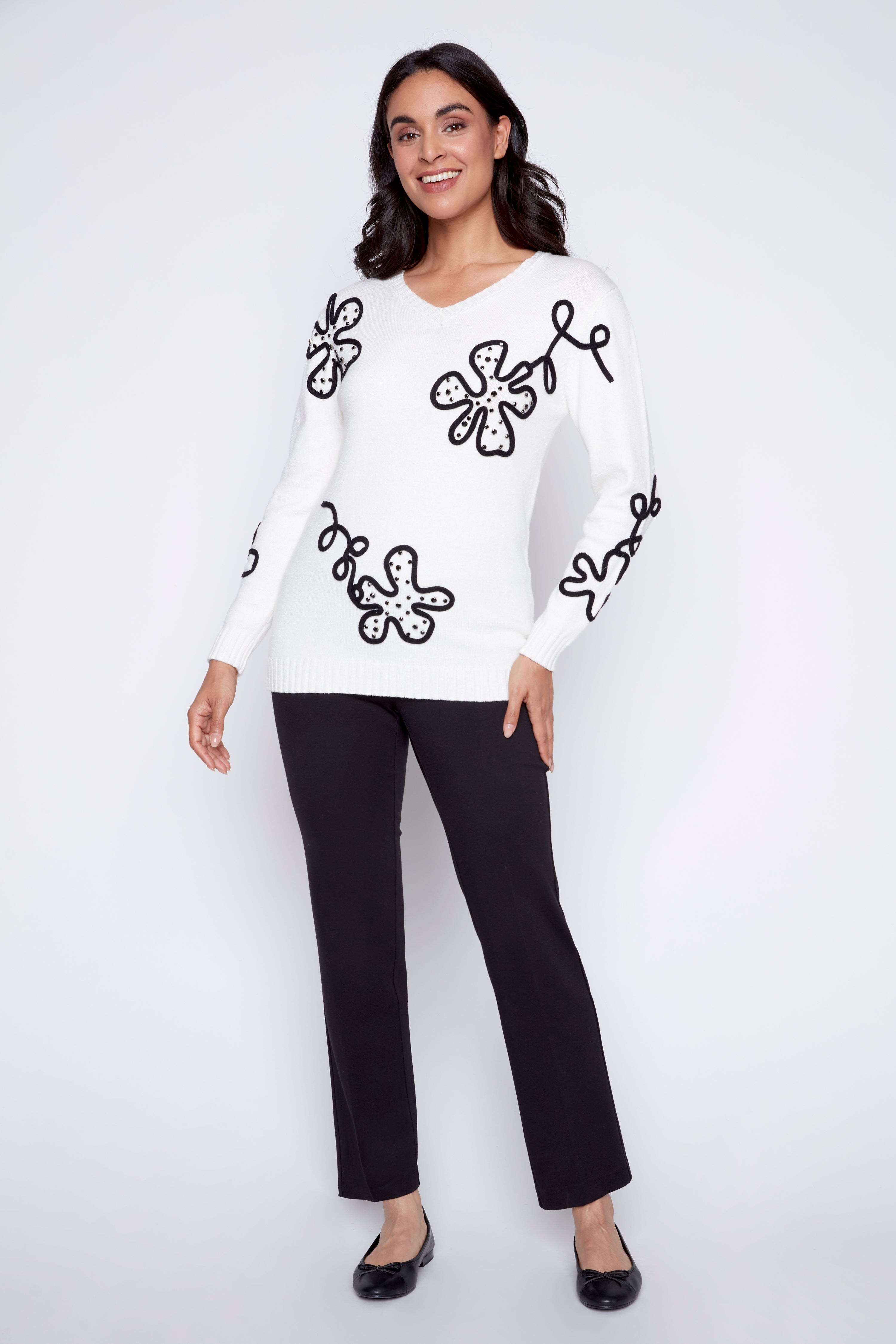 Le pull à motif floral abstrait