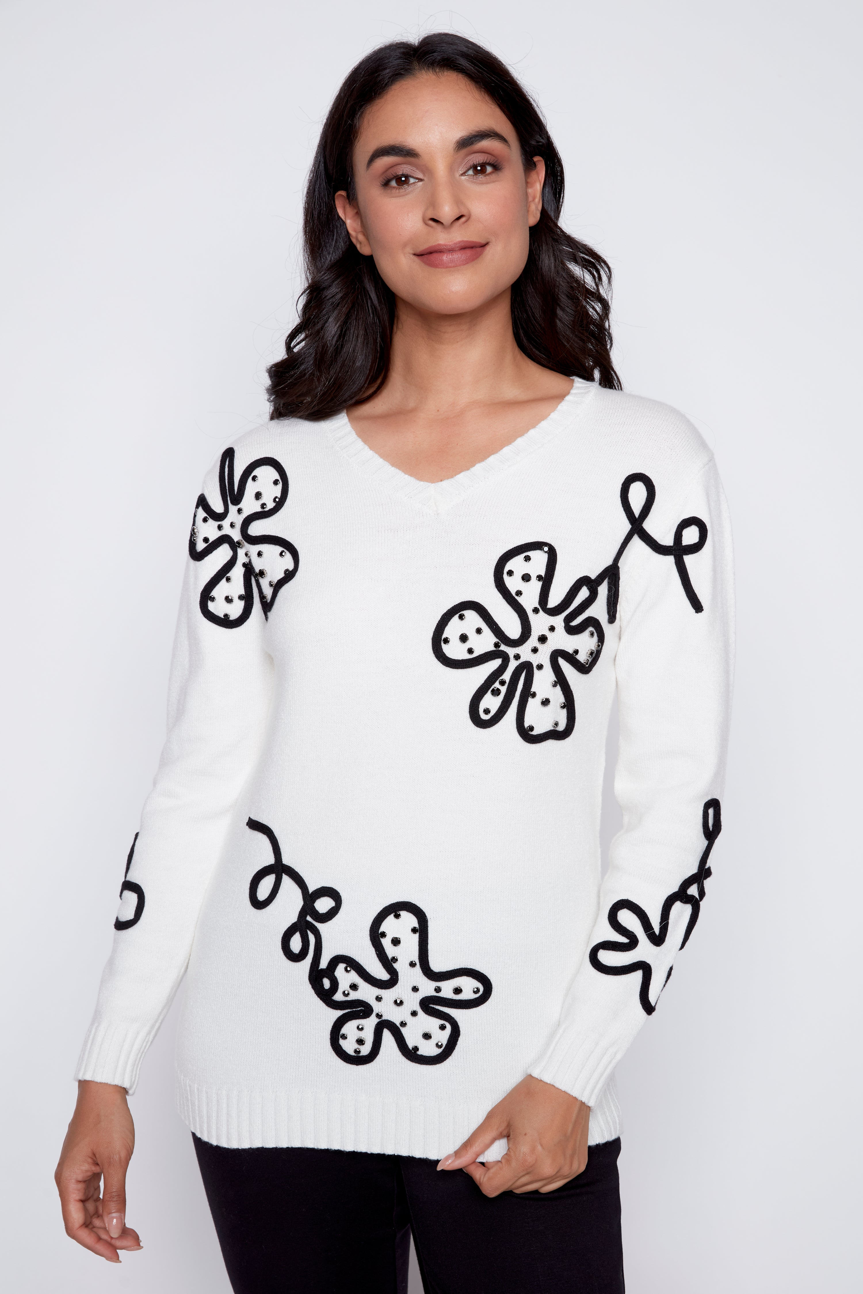 Le pull à motif floral abstrait