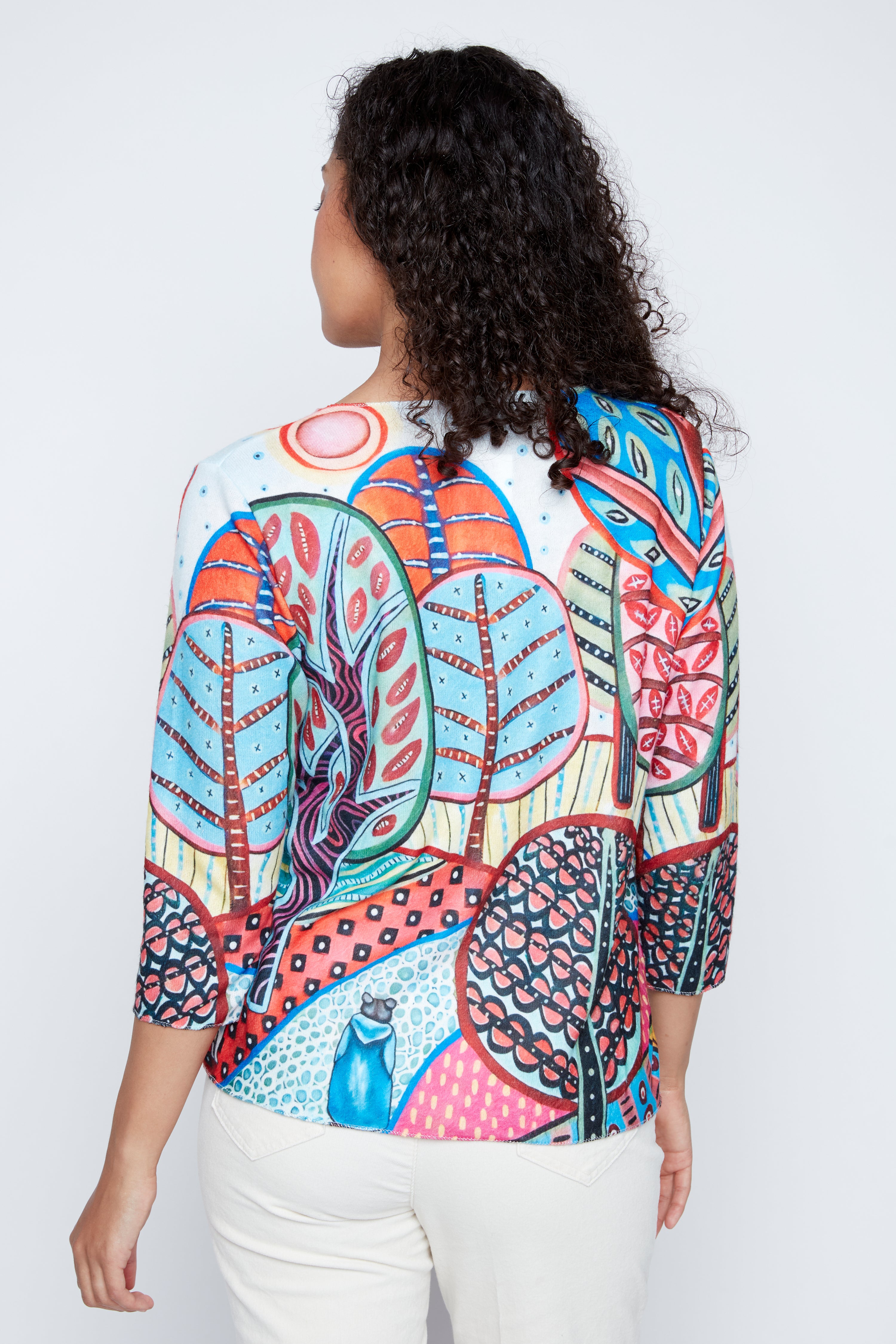 Colorful forest scene print knit sweater