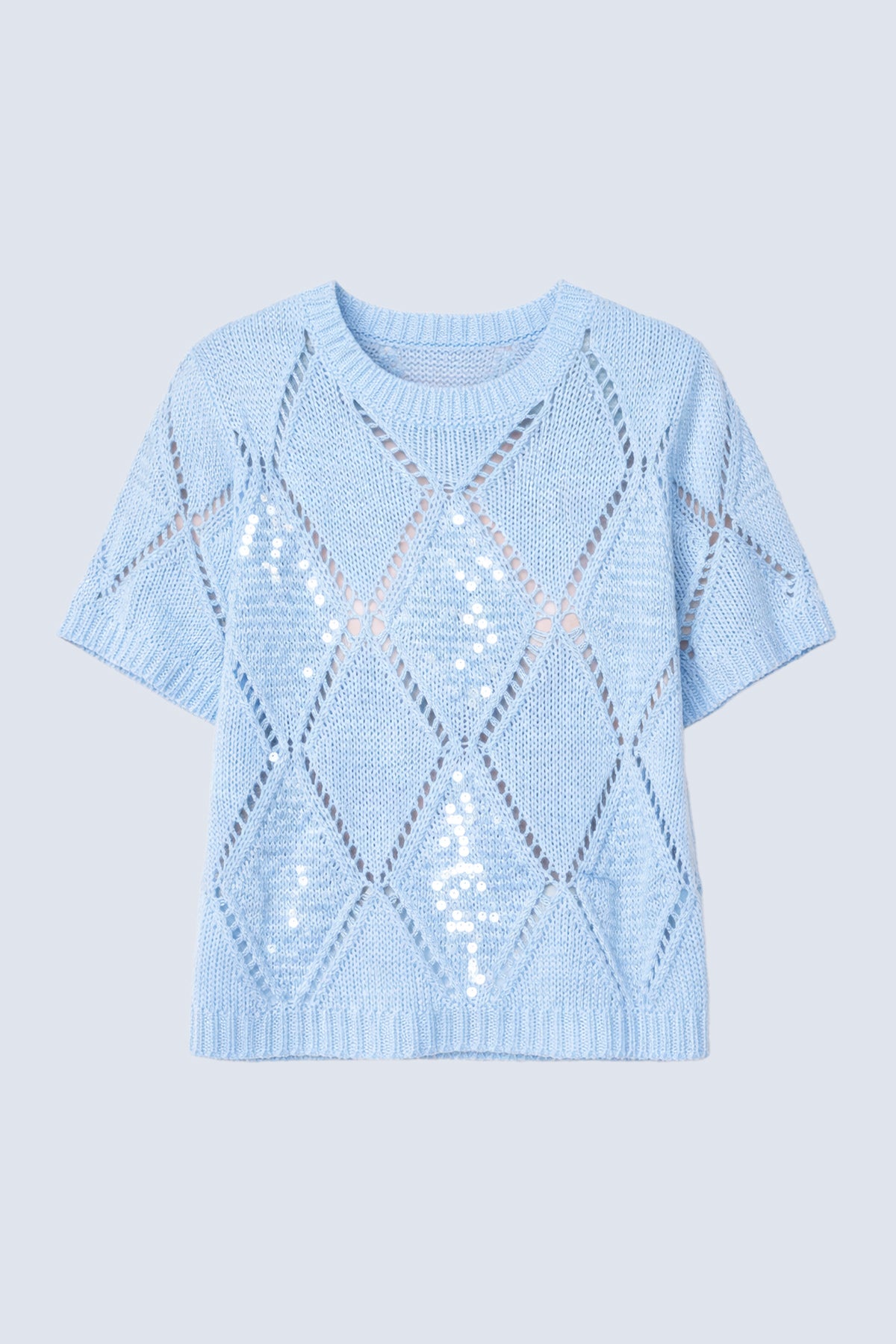 Le pull à motif de sequins en losanges