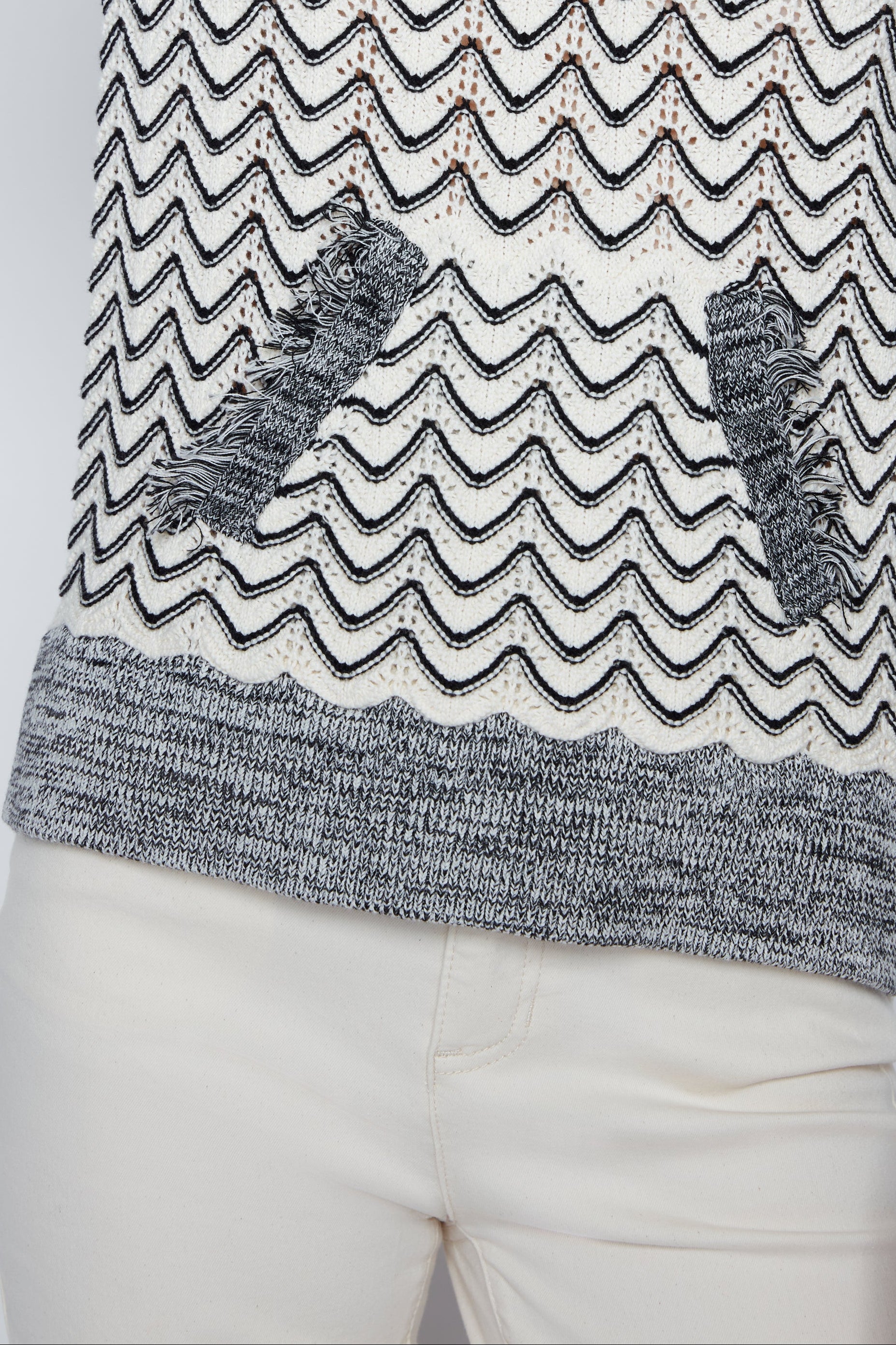 Hooded sweater with fringe trim