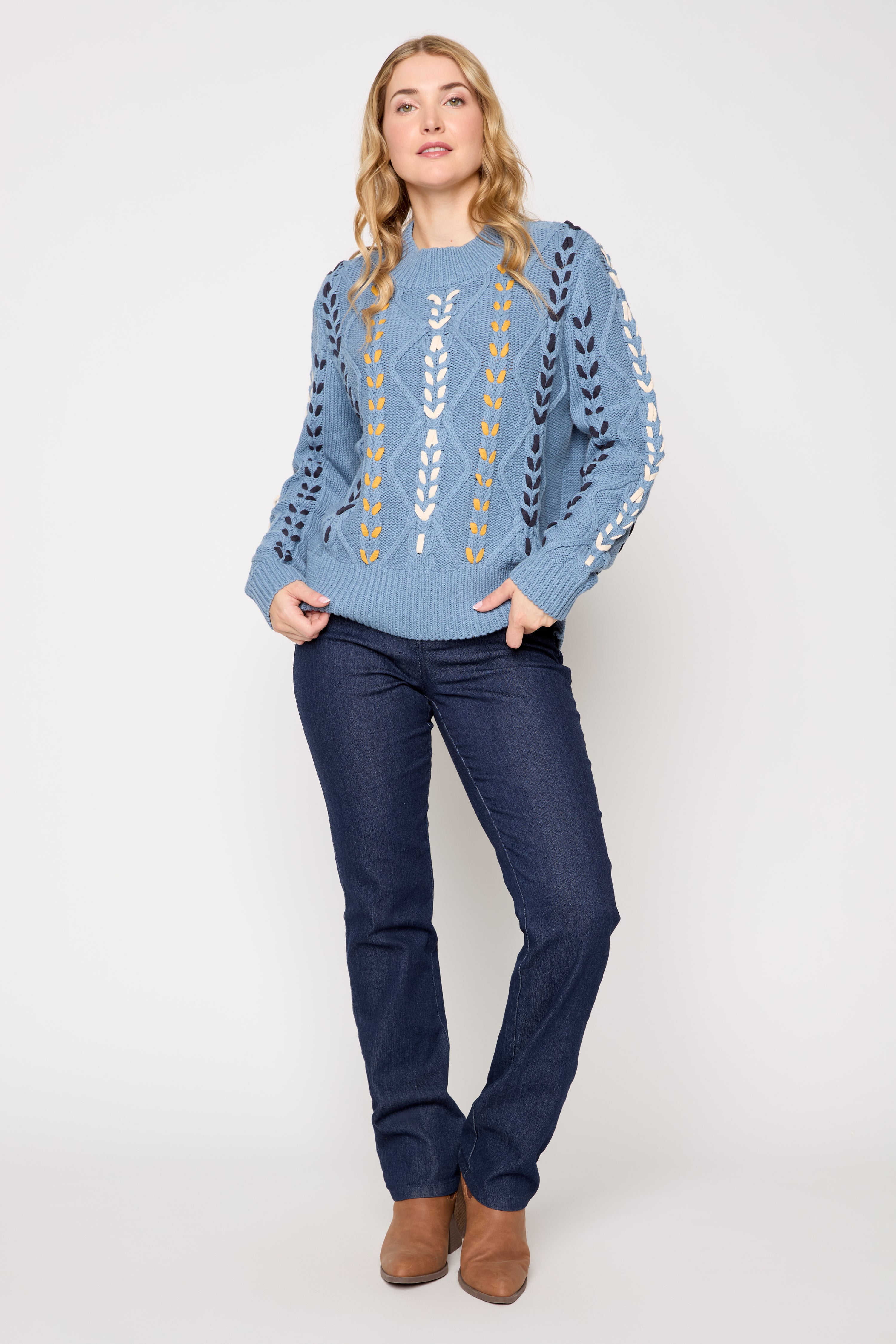 Le pull en mélange de coton à détails torsadés