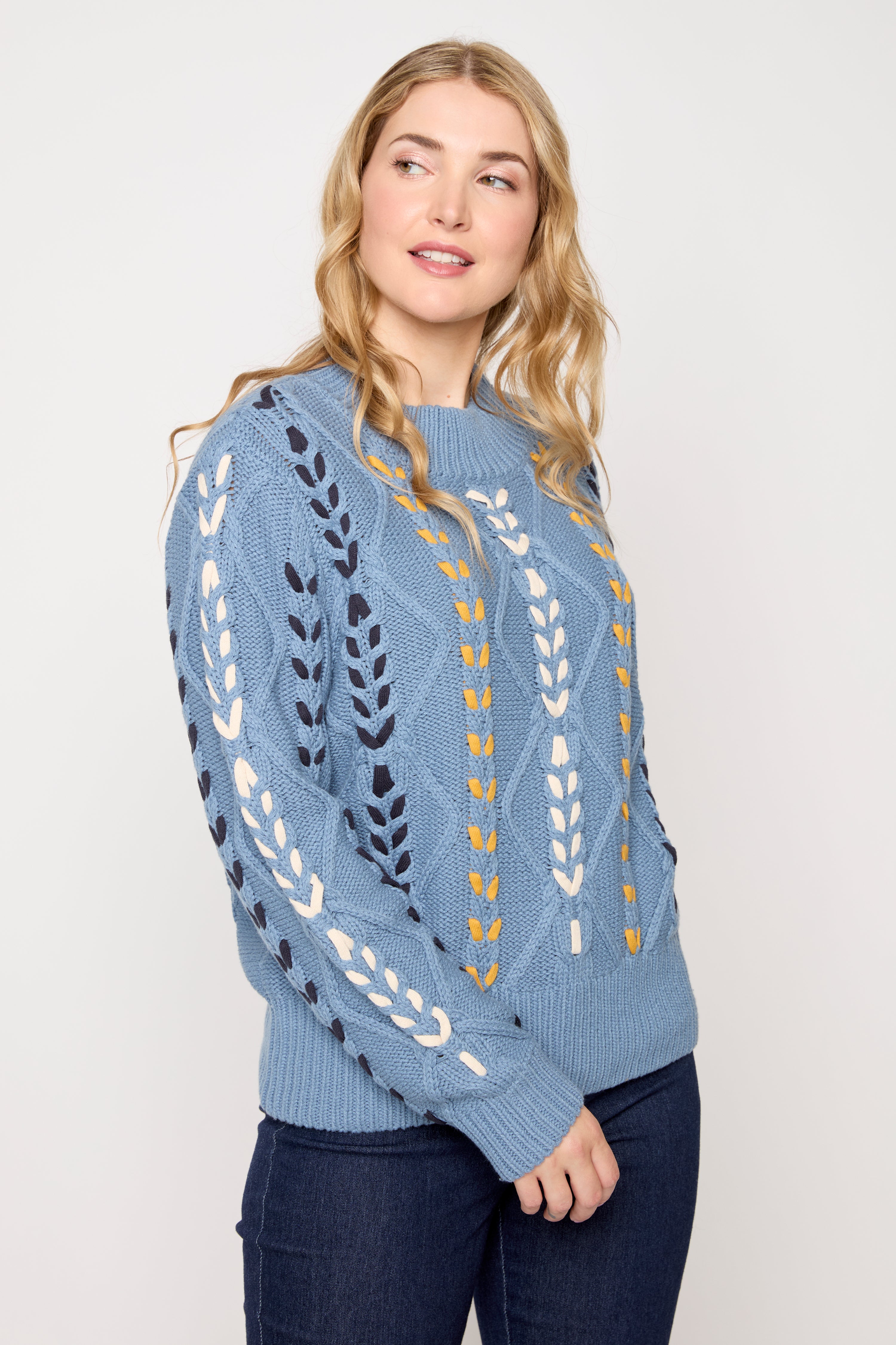 Le pull en mélange de coton à détails torsadés