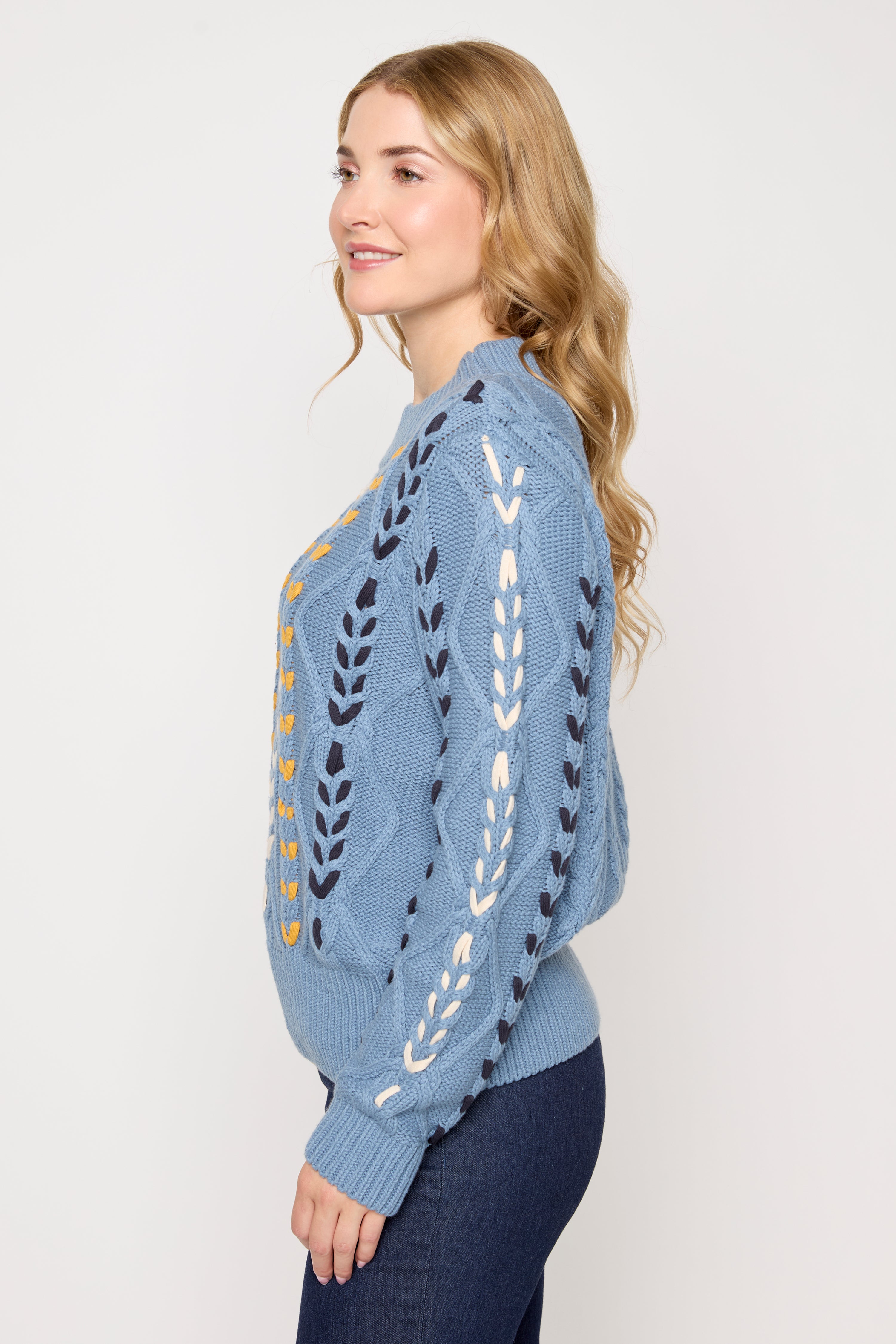 Le pull en mélange de coton à détails torsadés