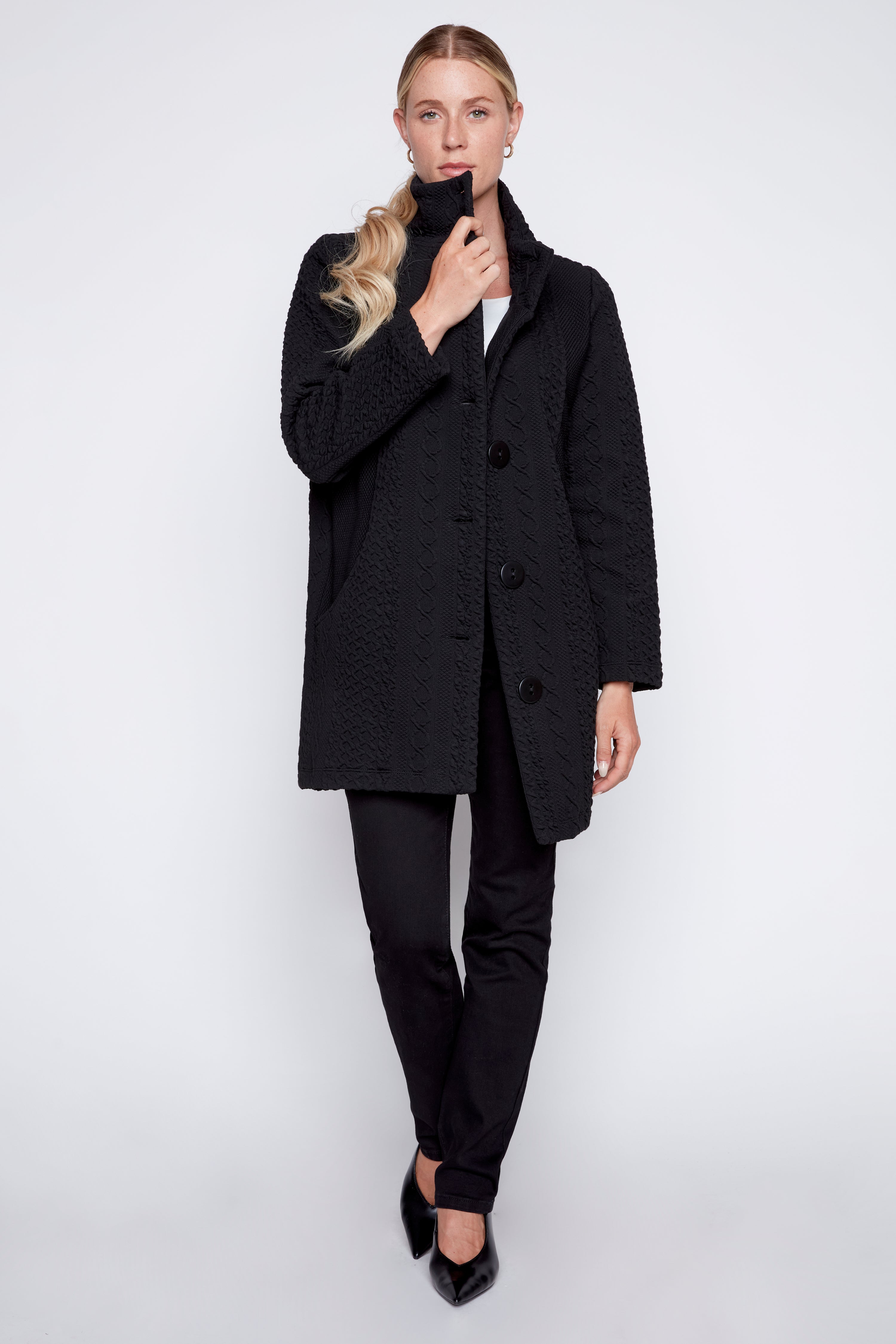 Le manteau en jacquard torsadé