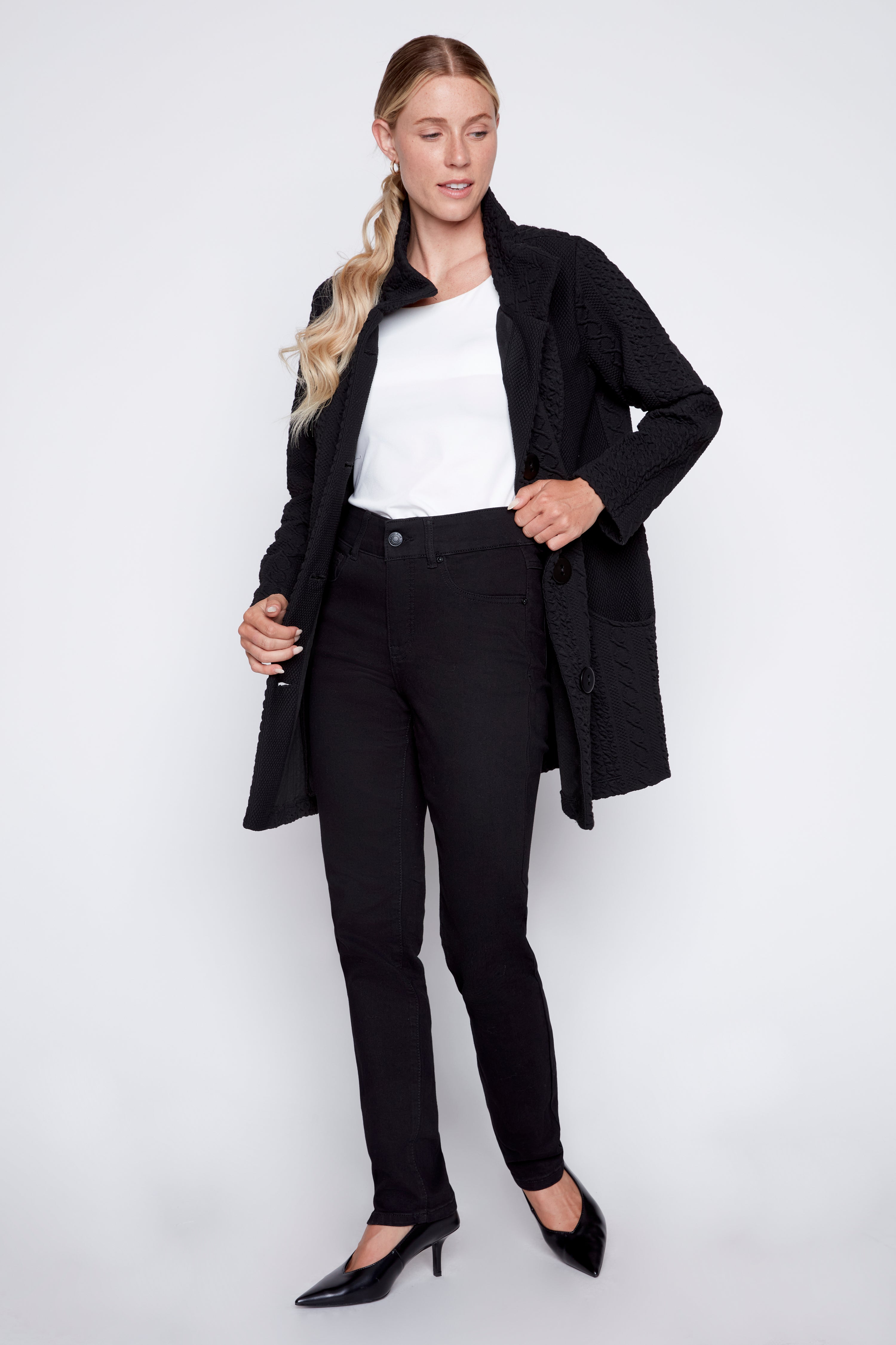Le manteau en jacquard torsadé