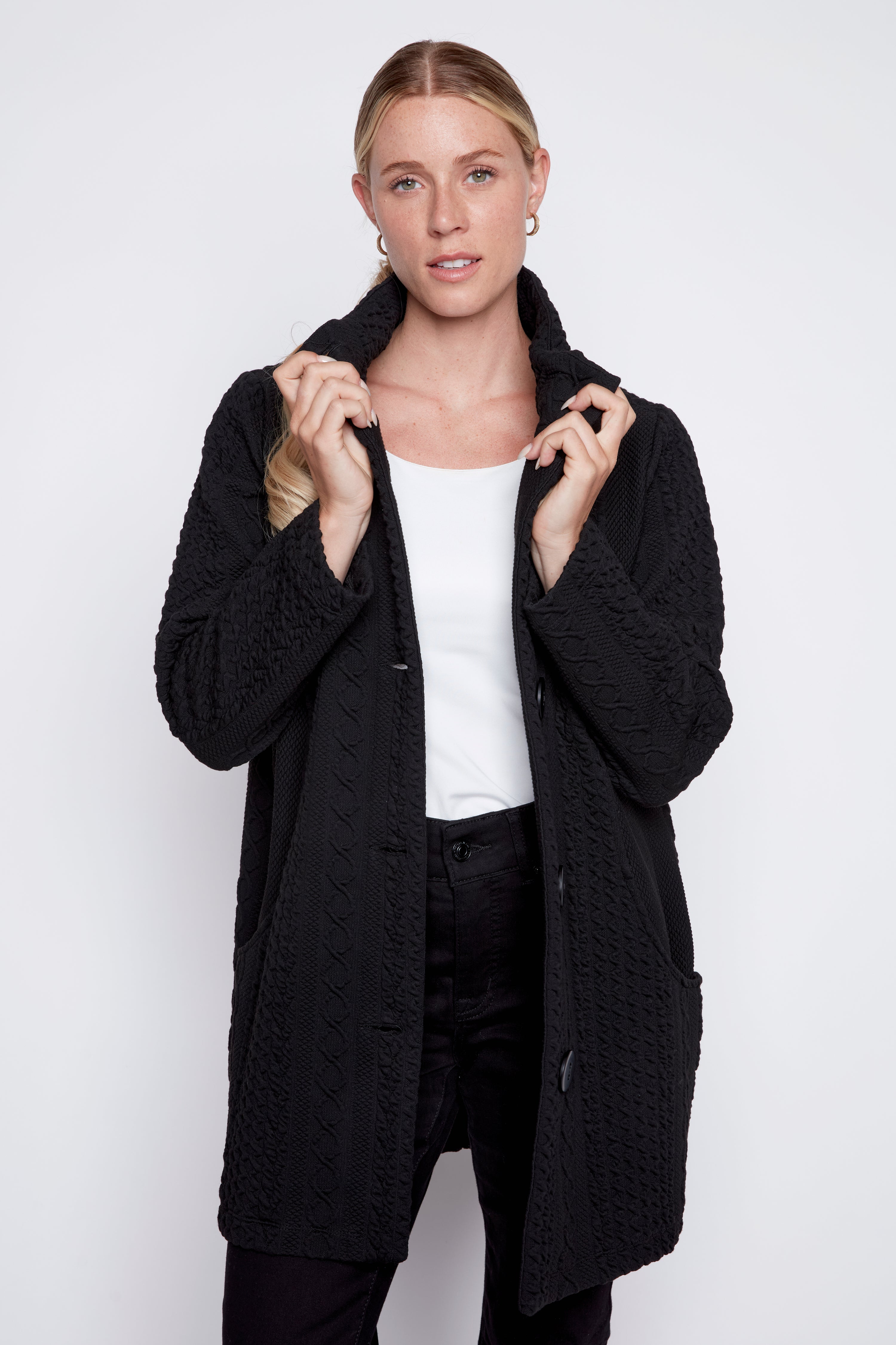 Le manteau en jacquard torsadé