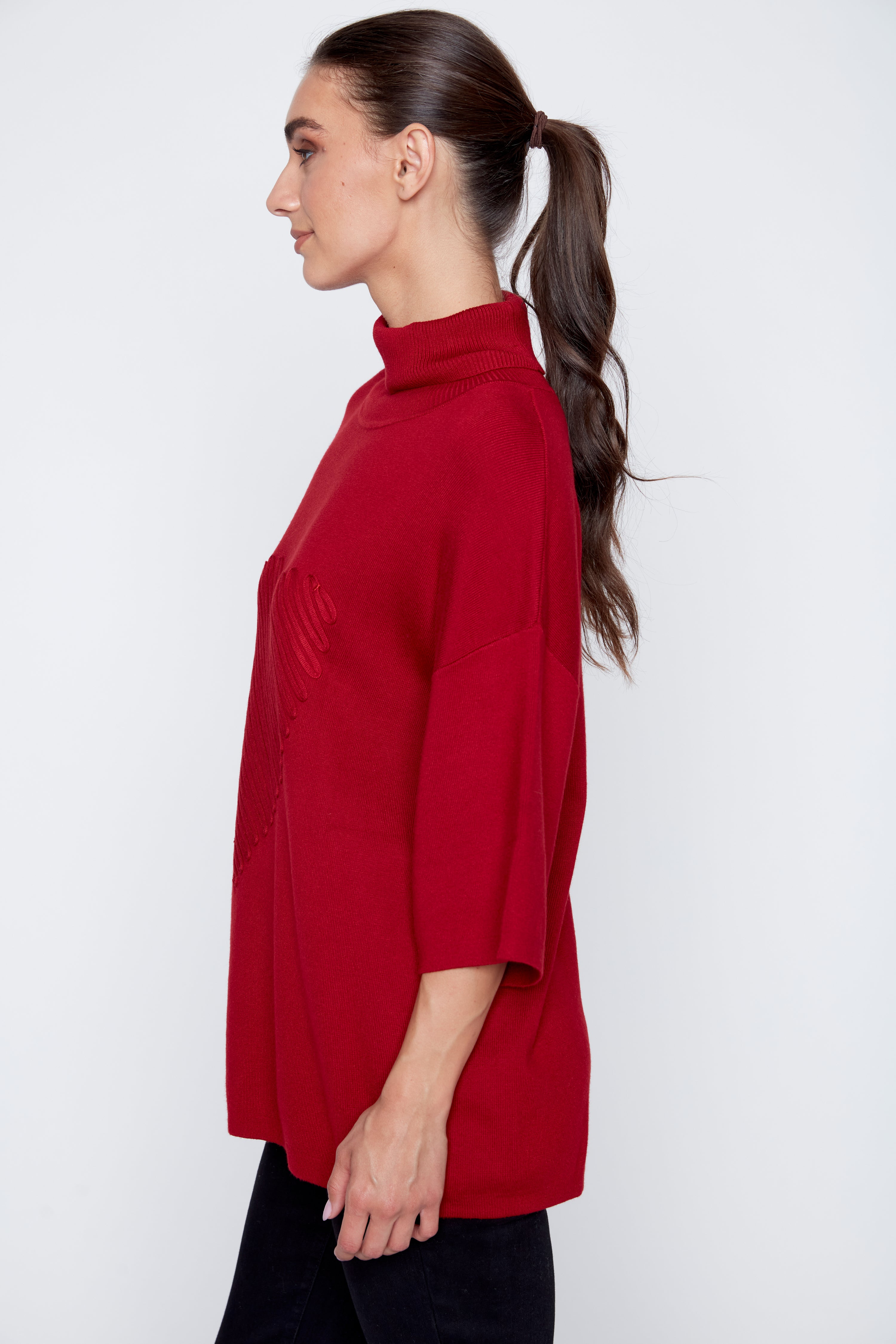 Le pull avec détails de cœur