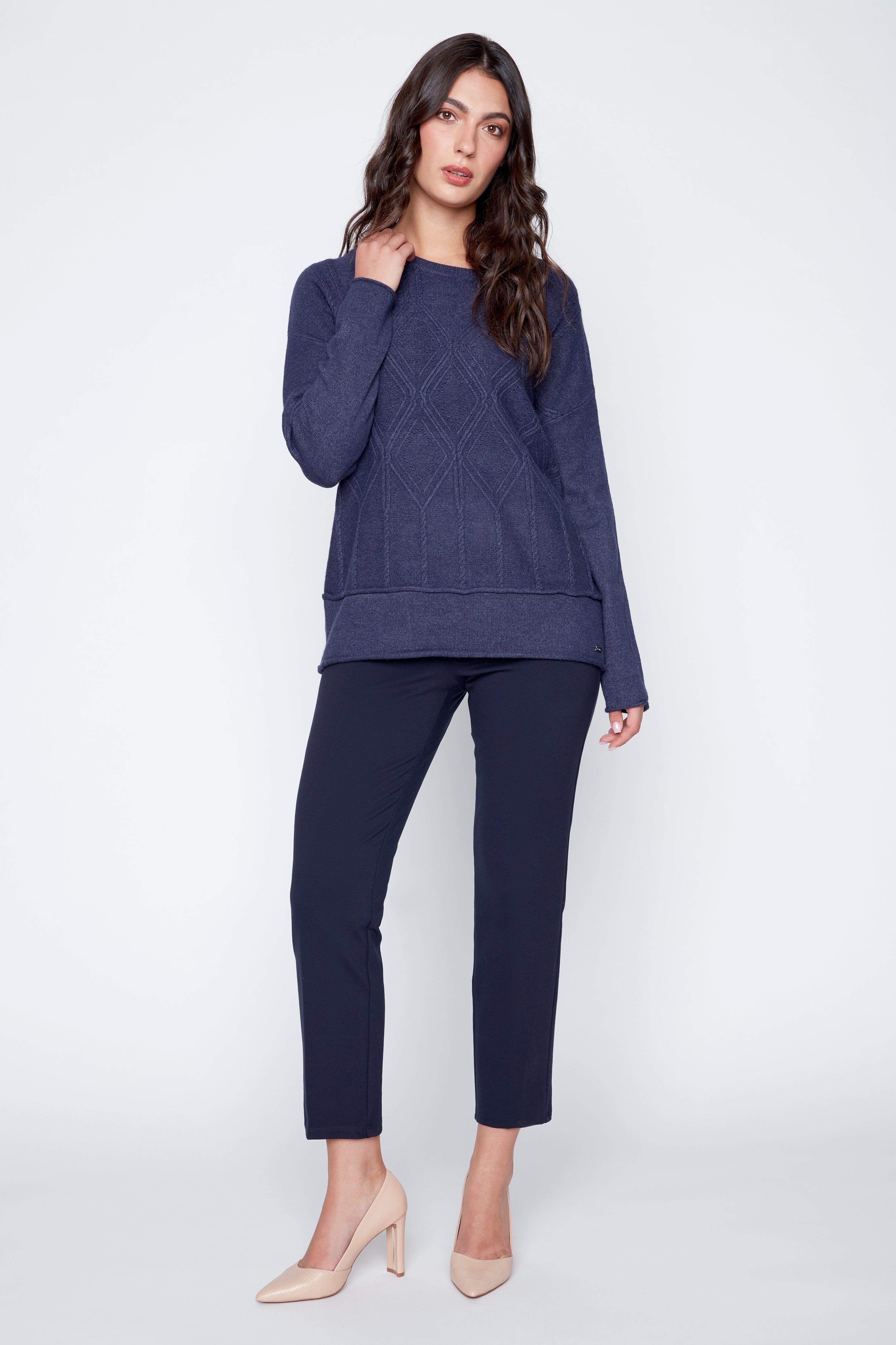 Le pull en maille torsadée à motif losanges