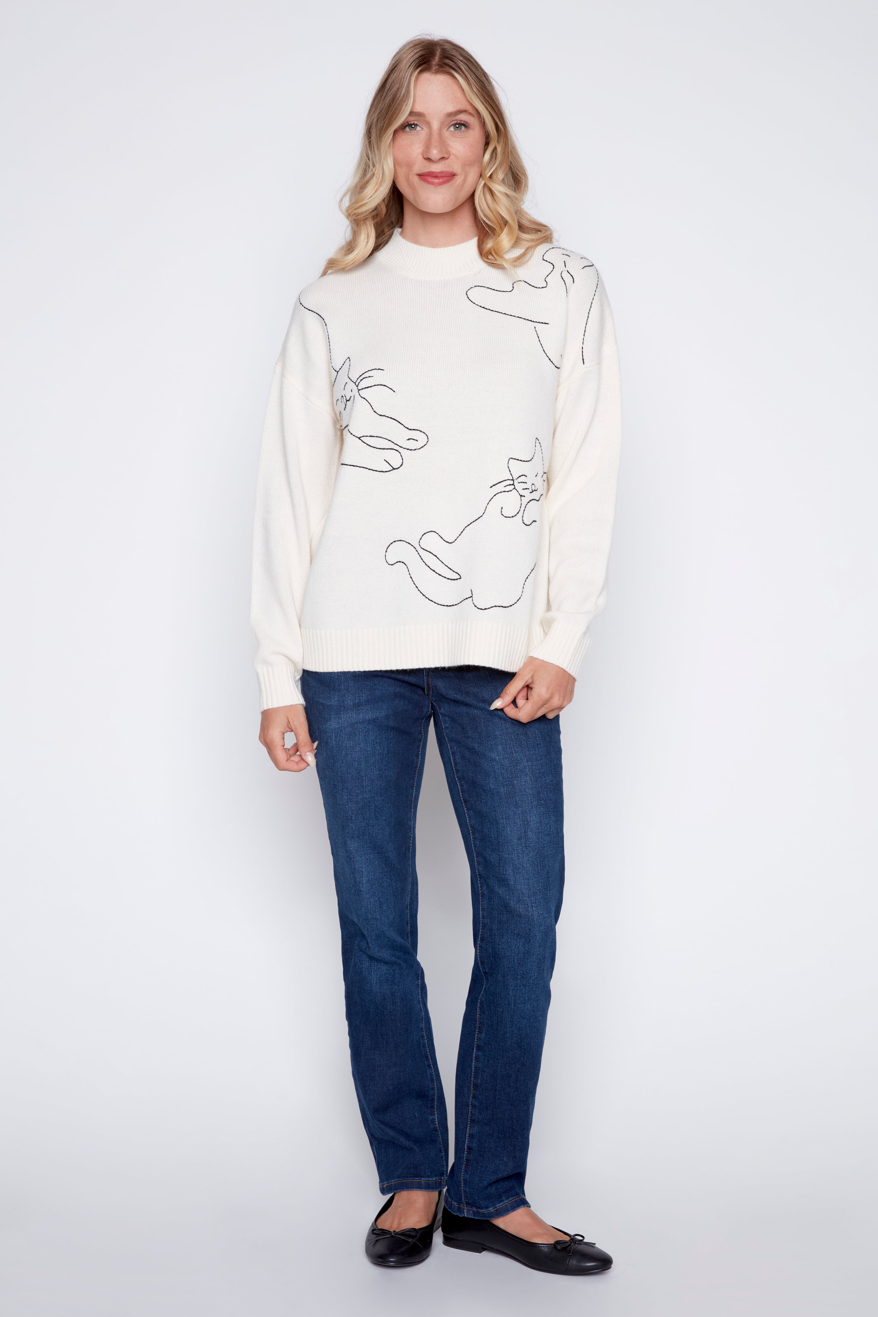 Le pull à motif chat