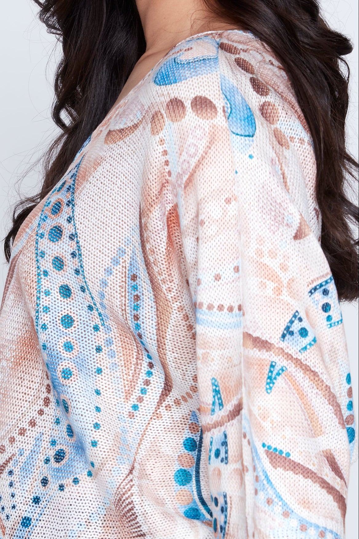 Le pull à motifs pois abstraits